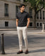 RENQARA Black Polo T-Shirt front fit on male model styled with ivory trousers