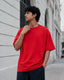 RENQARA Crimson Red Oversized T-Shirt showing oversized sleeve fall, relaxed drape and front fit