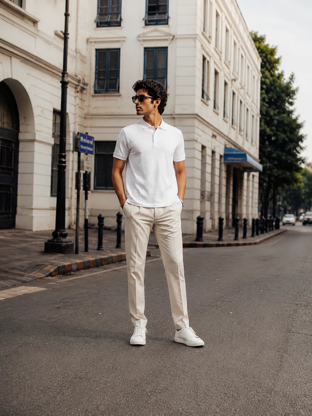 Full-body view of the RENQARA White Polo T-Shirt styled with cream trousers and white sneakers.