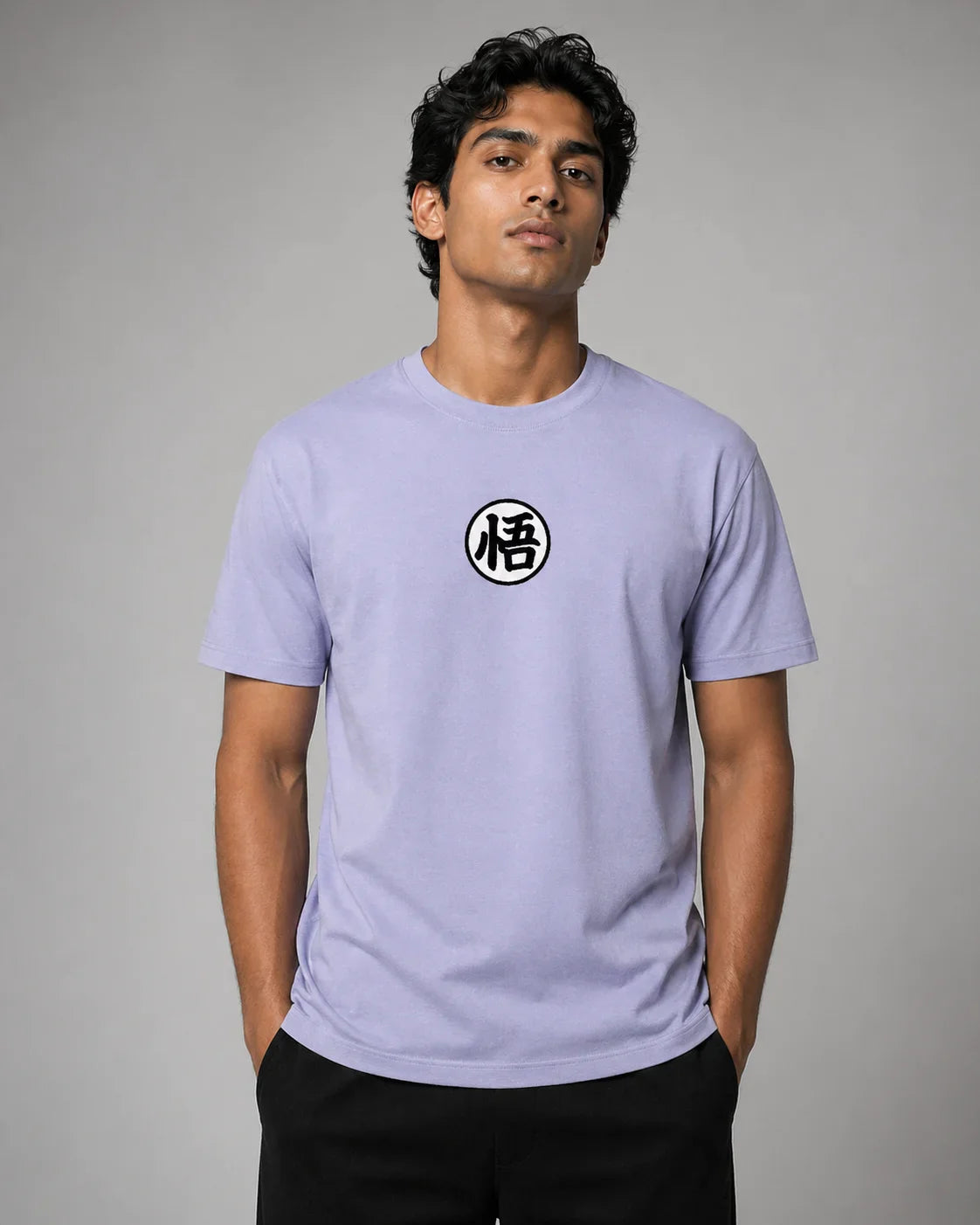 Man wearing a light purple t-shirt with a black and white symbol on a gray background Main image