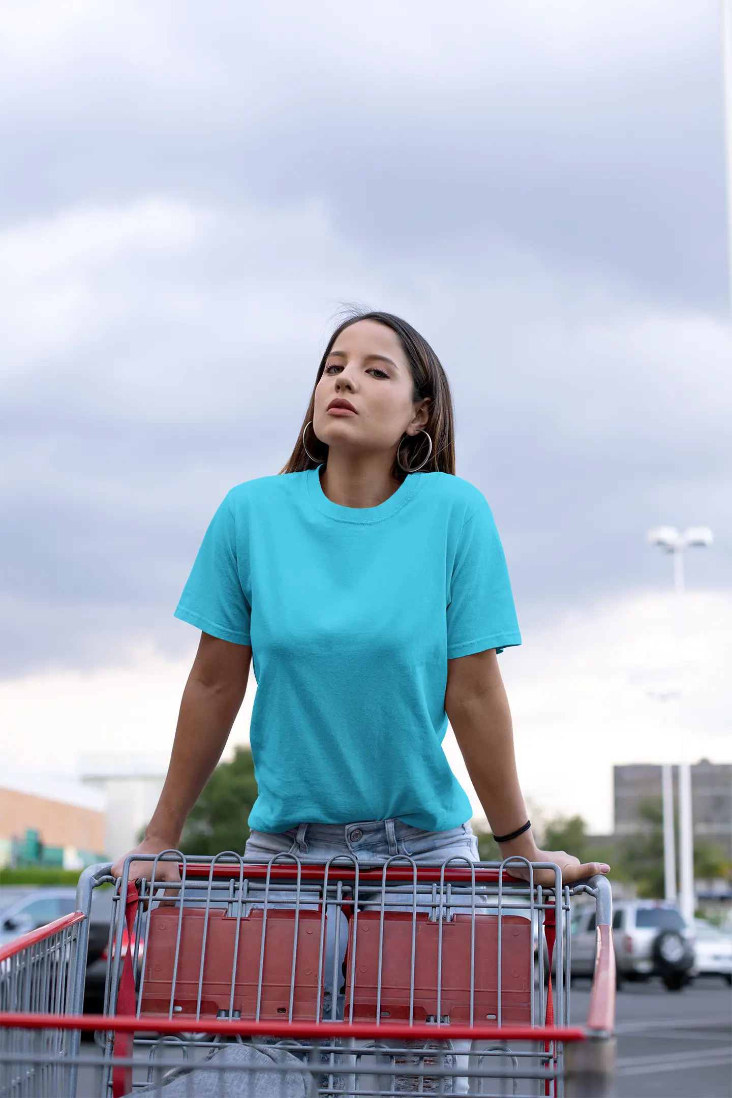 Woman wearing RENQARA Aqua Drift Classic Tee in a shopping cart editorial streetwear look.
