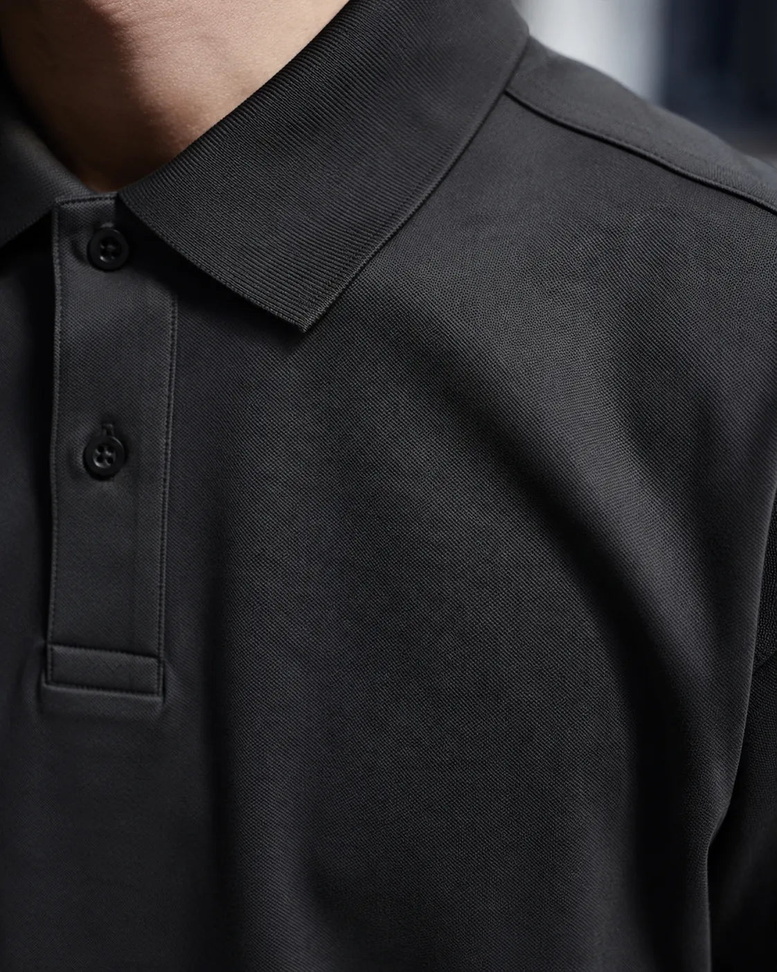 RENQARA Black Polo T-Shirt close-up showing collar, button placket and Pique Airtex fabric texture