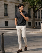 RENQARA Black Polo T-Shirt street-style look on male model with ivory trousers and loafers