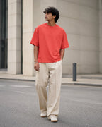 RENQARA Brick Red Oversized T-Shirt front fit on male model with relaxed oversized silhouette