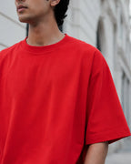 RENQARA Crimson Red Oversized T-Shirt close-up showing crew neck, shoulder drop and cotton fabric texture
