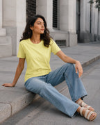 RENQARA Lemon Yellow Regular Fit T-Shirt seated lifestyle look styled with blue jeans