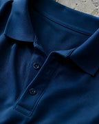 RENQARA Navy Blue Polo T-Shirt close-up showing collar, button placket and Pique Airtex fabric texture