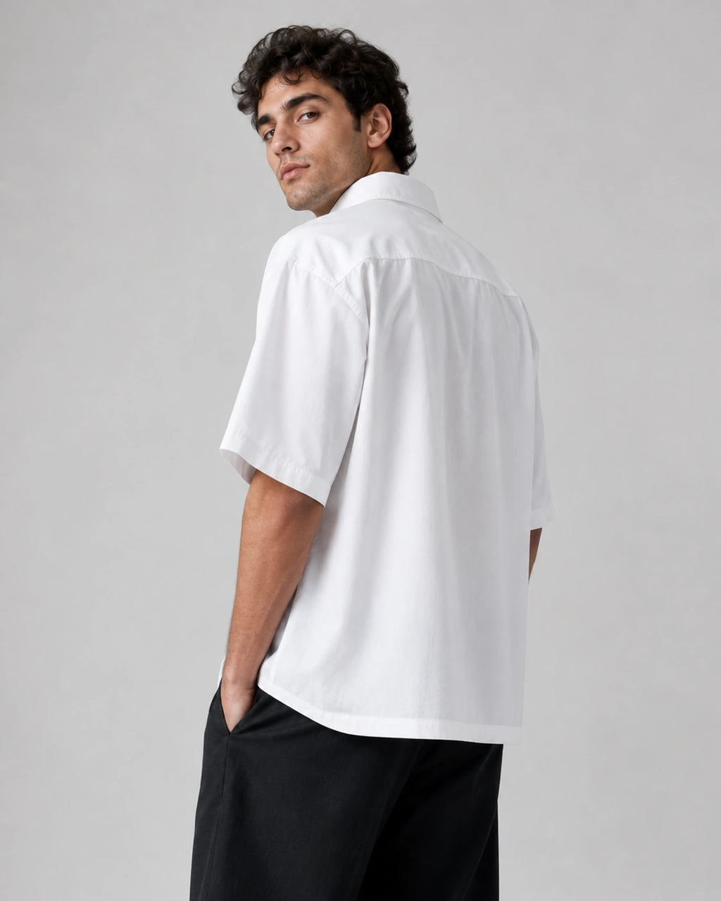 Back view of RENQARA White Flow Collar Shirt showing oversized fit, half sleeves, crisp cotton fabric and straight hem design.