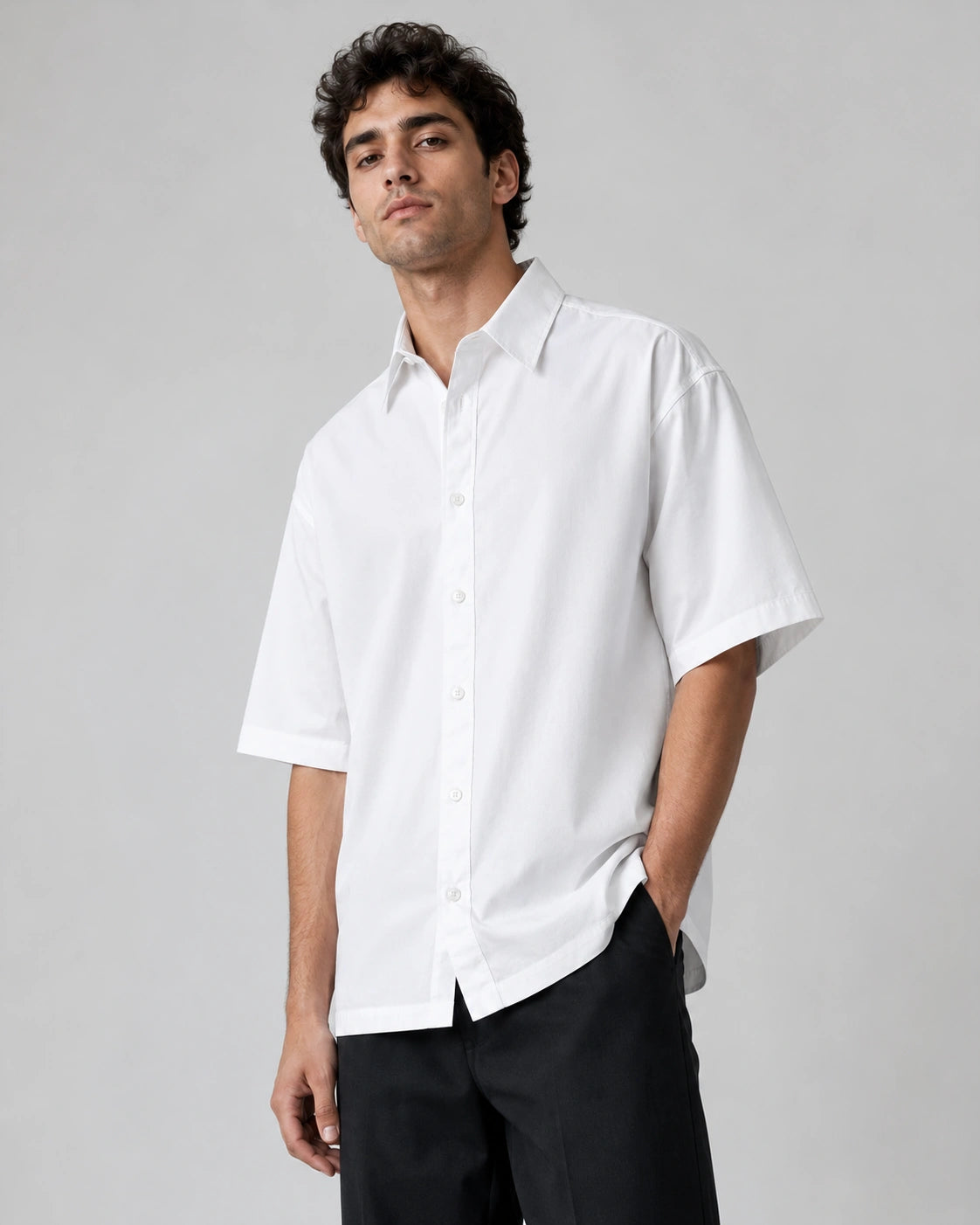 Male model wearing RENQARA White Flow Collar Shirt, oversized half-sleeve cotton shirt styled with black trousers for clean everyday wear. Main image