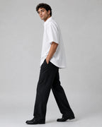 Side view of model wearing RENQARA white oversized cotton collar shirt with half sleeves, straight hem and relaxed streetwear styling.