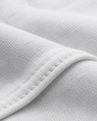 Close-up of the premium 230 GSM piqué cotton fabric used in the RENQARA White Polo T-Shirt.