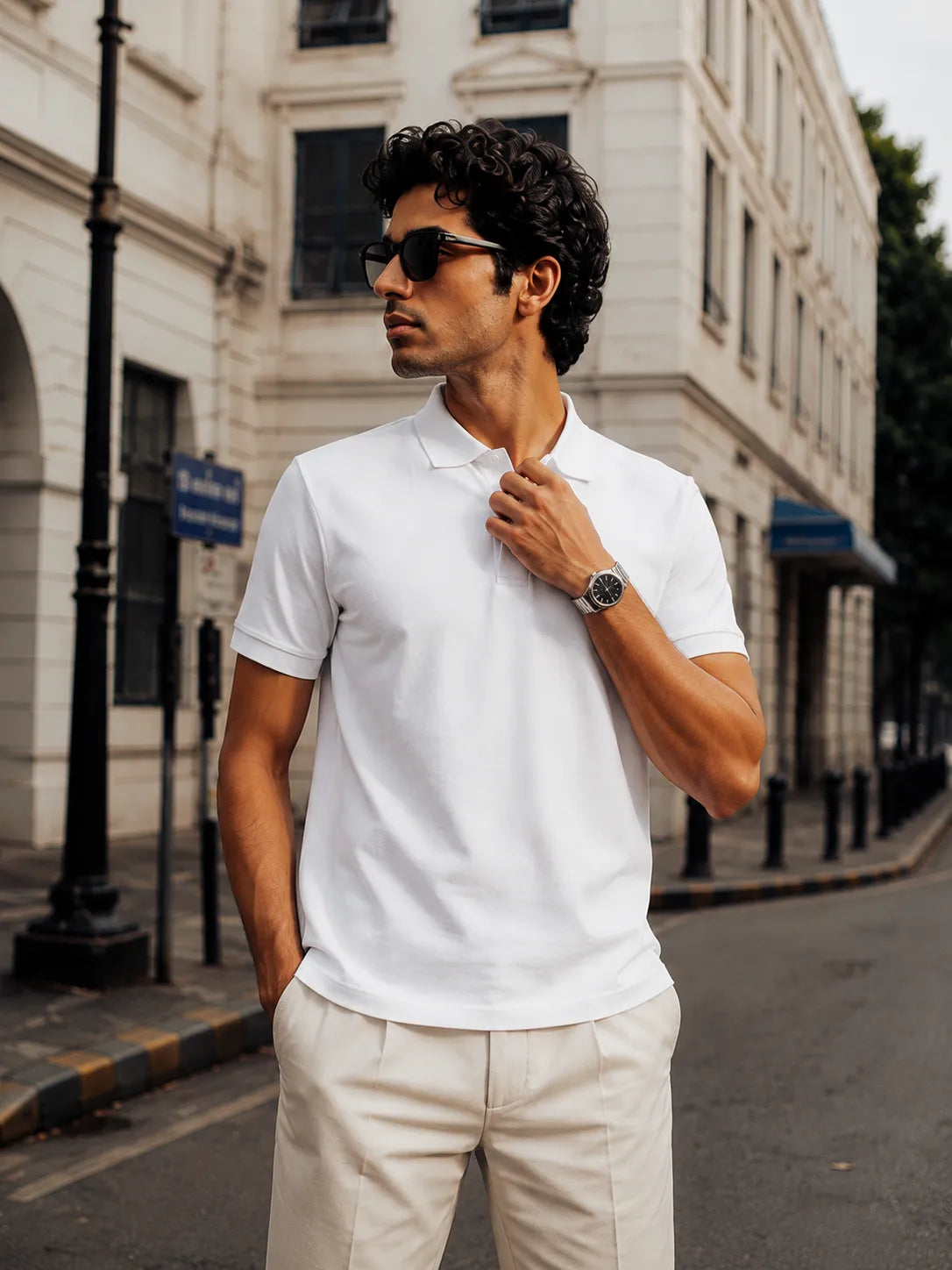 Model wearing the RENQARA White Polo T-Shirt paired with cream trousers for a refined smart-casual look.