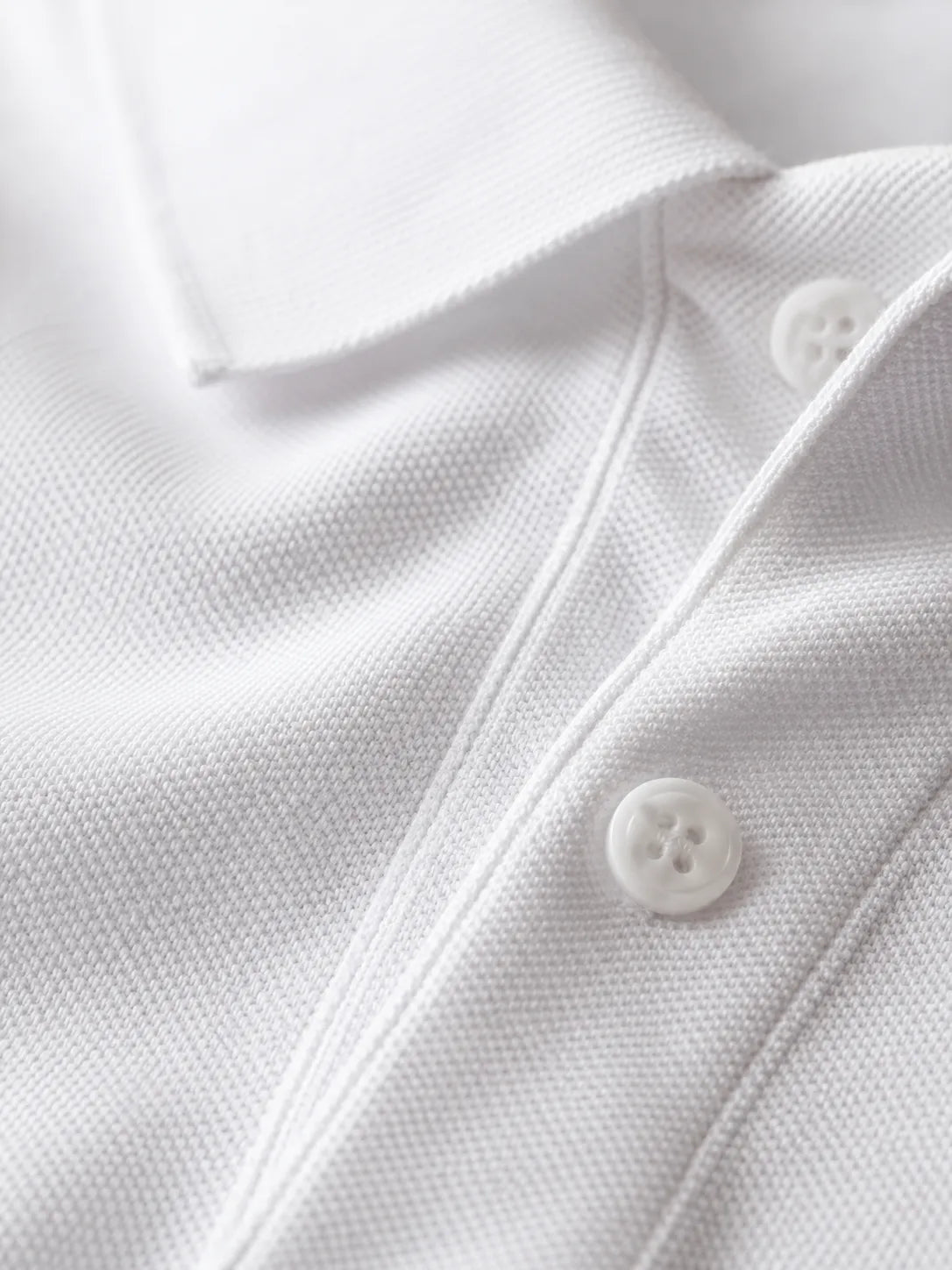 Close-up of the premium 230 GSM piqué cotton fabric on the RENQARA White Polo T-Shirt.