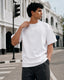RENQARA White Supima T-Shirt front fit on male model showing clean neckline, sleeve length and smooth Supima cotton