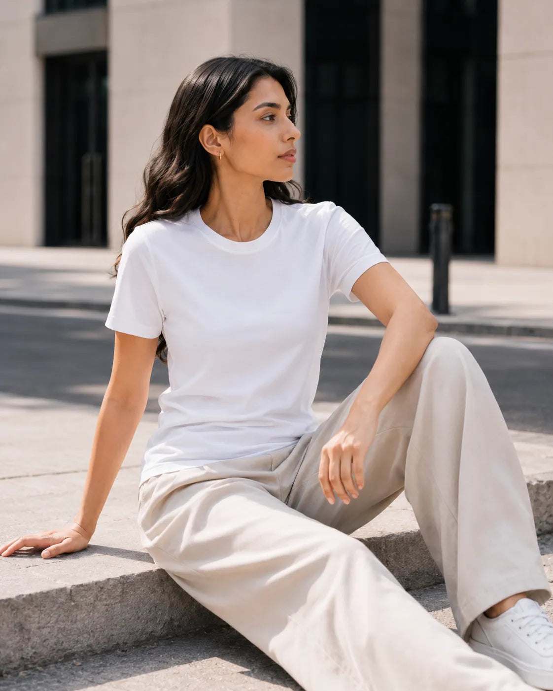 RENQARA White Women’s Regular Fit T-Shirt seated lifestyle look styled with beige trousers and white sneakers