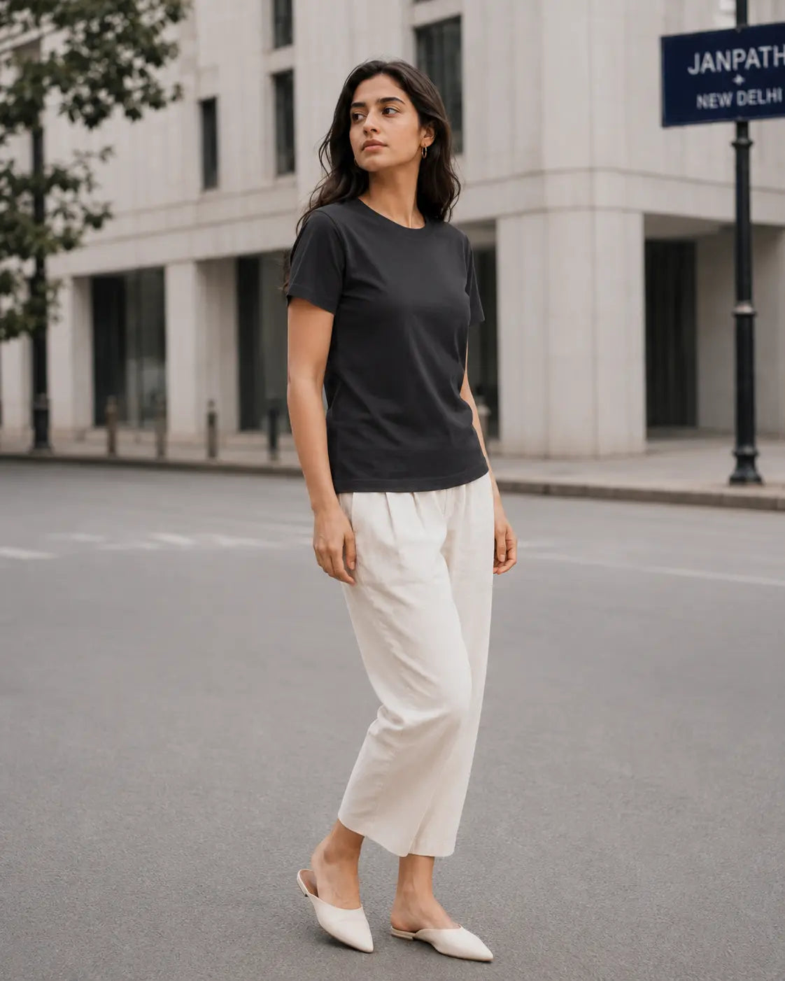 RENQARA Women’s Black Regular Fit T-Shirt front fit on female model styled with white trousers