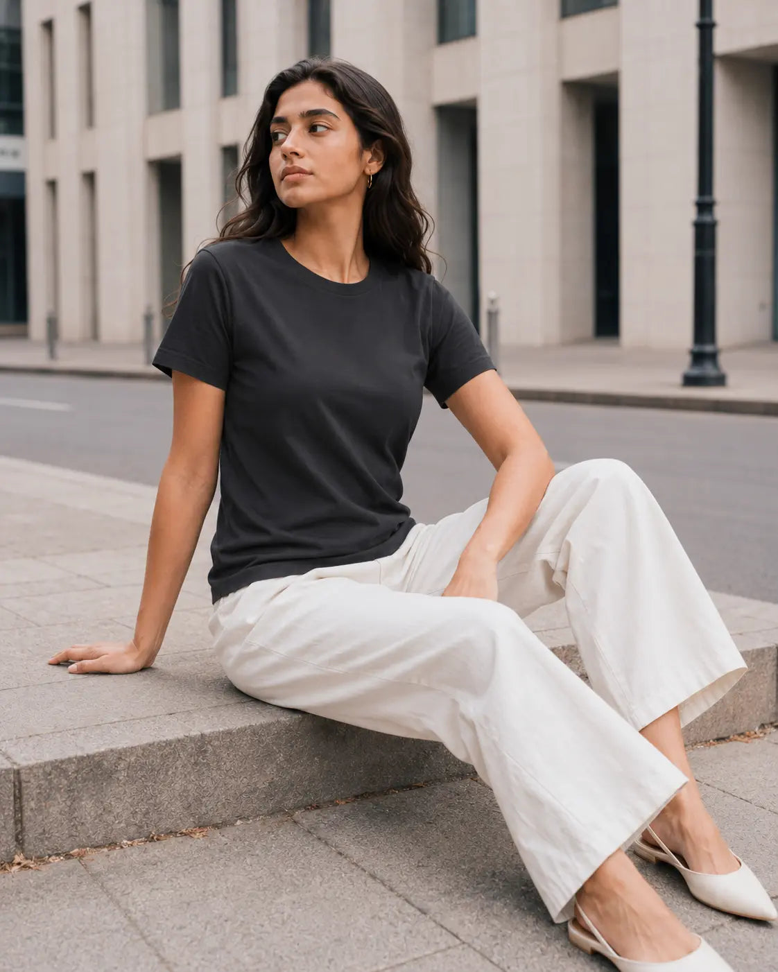 RENQARA Women’s Black Regular Fit T-Shirt on female model in a seated casual look showing regular fit and soft drape